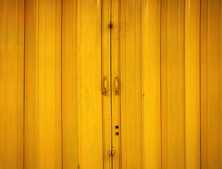yellow metal fence door