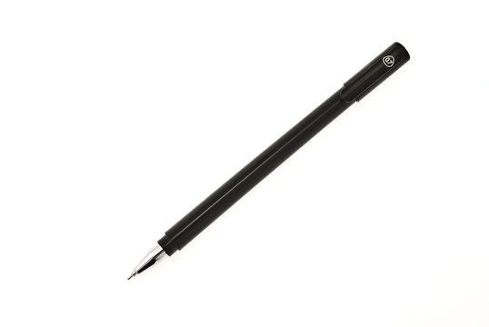 Ballpoint pen over white background