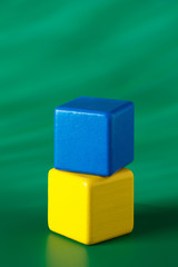 Blue & yellow blocks on green background 3