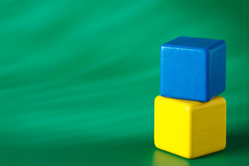 Obraz premium Blue & yellow blocks on green background 2