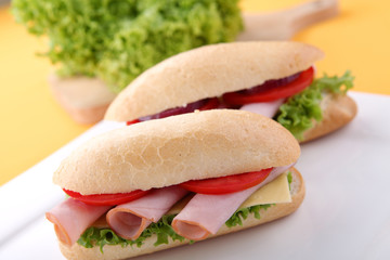 Sandwich with fresh vegetables, ham and cheese
