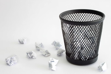 Trash bin and paper - office concept