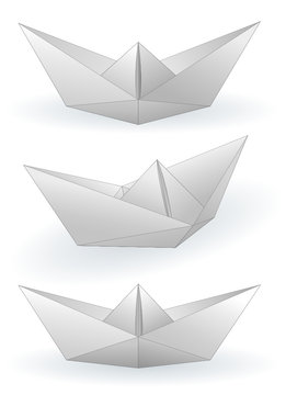 Three paper ships isolated on white