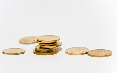Golden coins isolated on white background