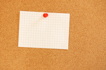 blank sheet of paper on bulletin board