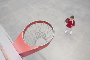 Boy on basket ball court