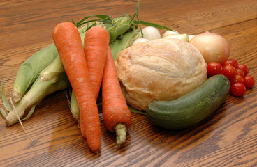 Bread and Veggies on an Oak Table
