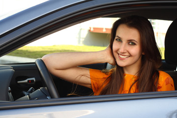 a young woman with her car