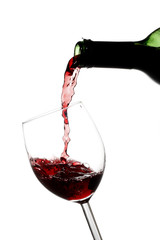 Red wine pouring into a wine glass
