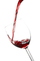 Red wine pouring into a wine glass