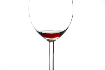 A small amount of red wine left in the glass