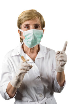 Mature woman doctor pointing upwards