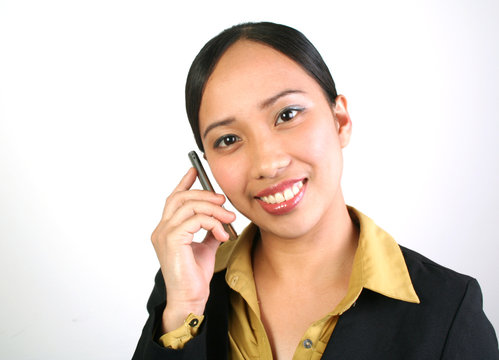 Portrait of business women using cell phone.