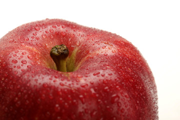 detail of fresh red apple with water drops