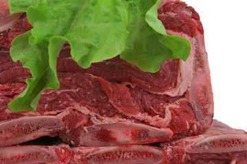 ribs heap over white with salad