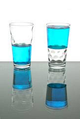 Two glasses with blue liquid