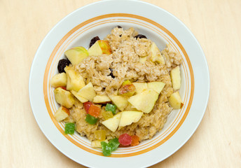 Porridge with fruits in plate
