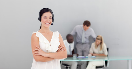 Attractive businesswoman with a headset on