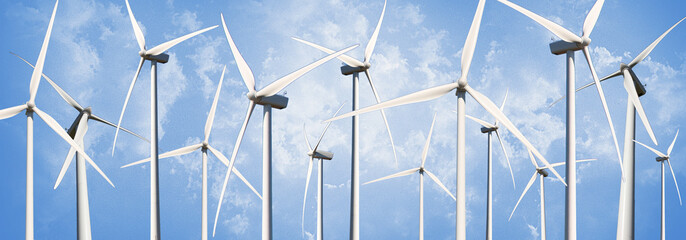 several Power Generating Windmills isolated on blue sky