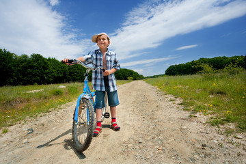 Naklejka premium Boy with bike