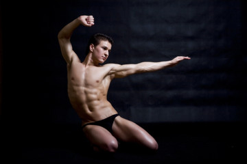 muscular man posing artistic
