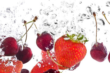 mixed fruit under water with white background