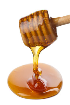 wooden dipper with honey isolated