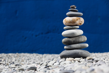 A pile of rocks stacked on the beach