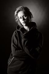 Low Key Shot of a Blonde Girl in Hooded Top