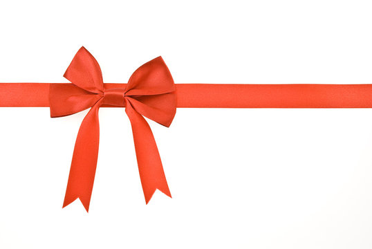 Red gift satin ribbon and bow on white background