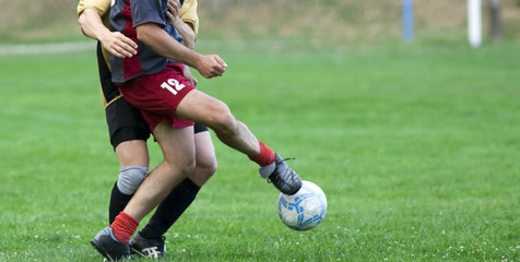 Soccer player kicking the ball