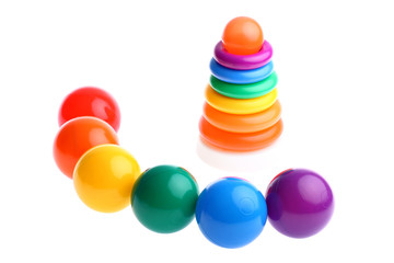Six plastic toy balls with stacking rings toy isolated on white
