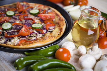 Fresh vegetables with a pizza