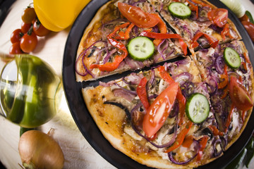 Vegetables with a pizza