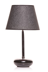 A modern black lamp isolated on a white background