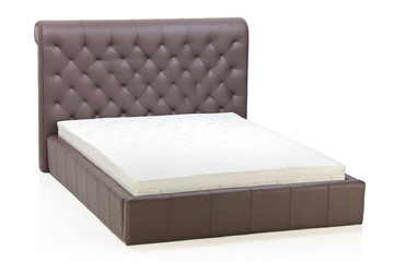 A view of a modern bed in an empty room