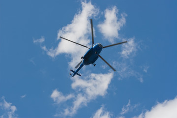 Fototapeta na wymiar Helicopter in blue sky