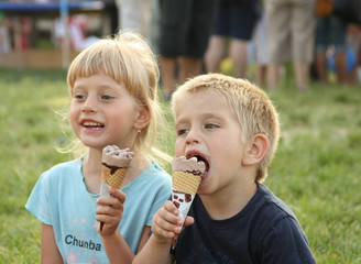Boy and girl eat ice cream