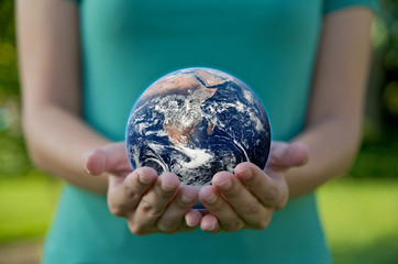 Hand holding a globe. Save Earth Environment