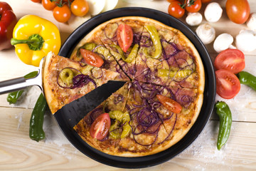 Pizza slice-lifted with cheese strings
