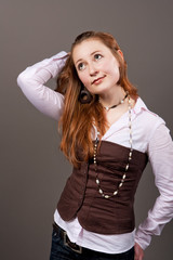 Fototapeta premium red haired pretty young girl isolated
