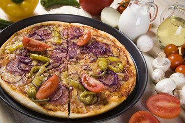 Vegetables with a pizza
