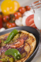 Fresh vegetables with a pizza