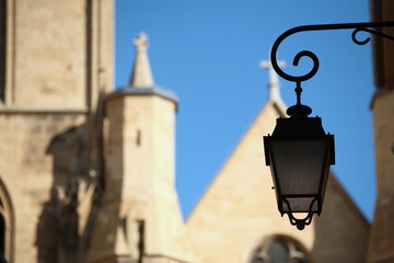 Lamppost in Aix-en-Provence with the church