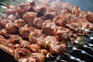 Preparation of meat on fire