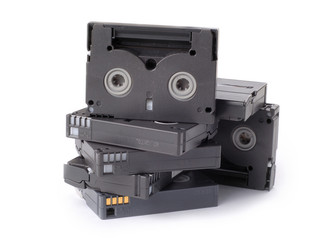 A few used Hi-8 video tapes stack up with white background