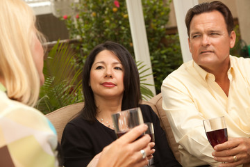 Three Friends Enjoying Wine on the Patio