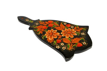 Black wooden cutting board painted with flowers isolated