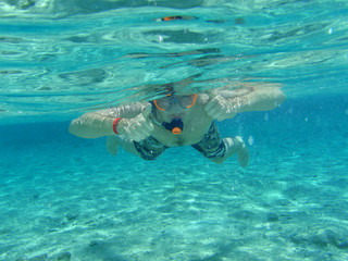 man snorkelling underwater