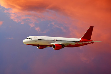 Obraz premium airplane in air on sunrise sky